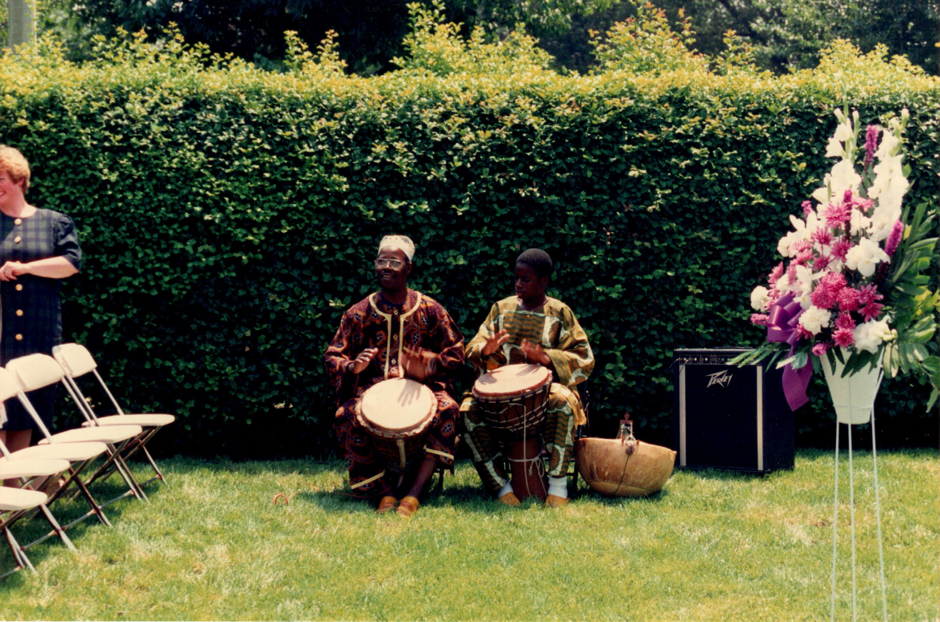 Djimo and Amadou Kouyate playing drums