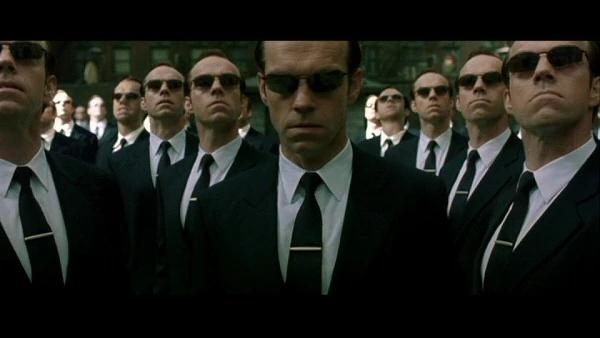 many agents from the Matrix standing together with Agent Smith in front