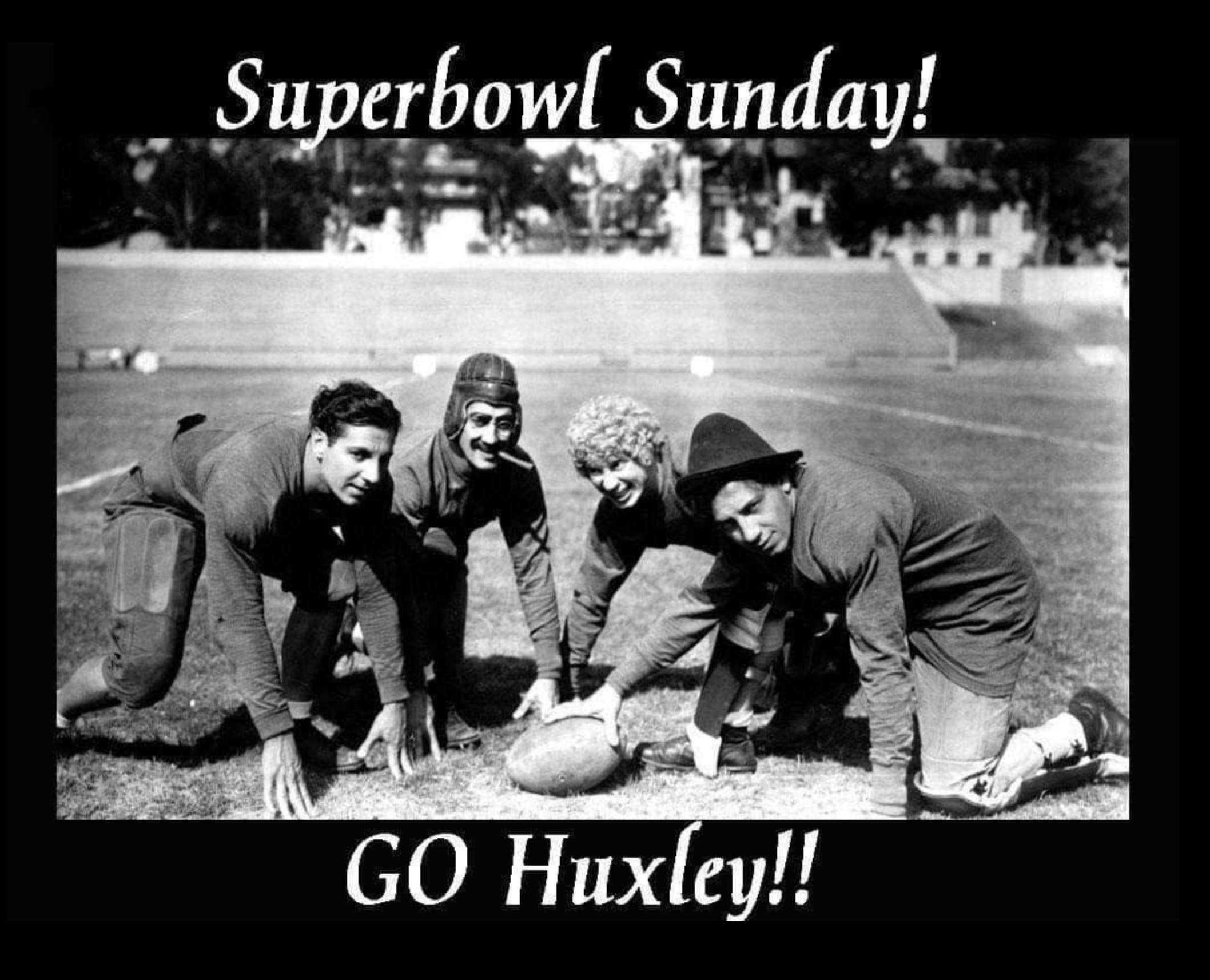 picture of the 4 Marx brothers hunkered down on a football field with a football (groucho has glasses and a cigar)